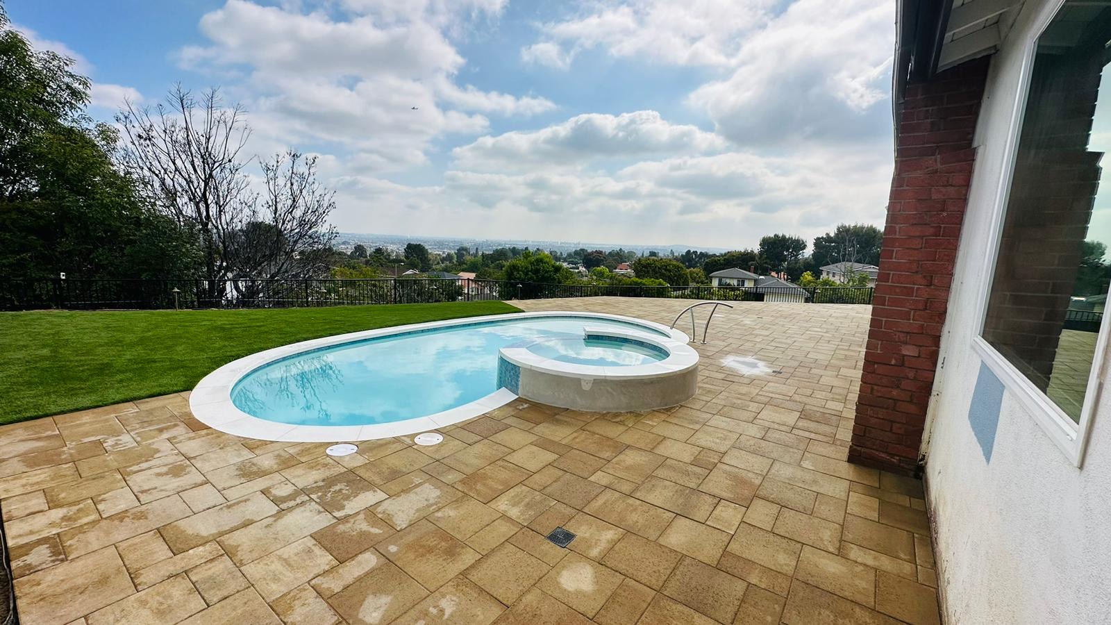 Completed pool, spa, pavers and turf outdoor living project