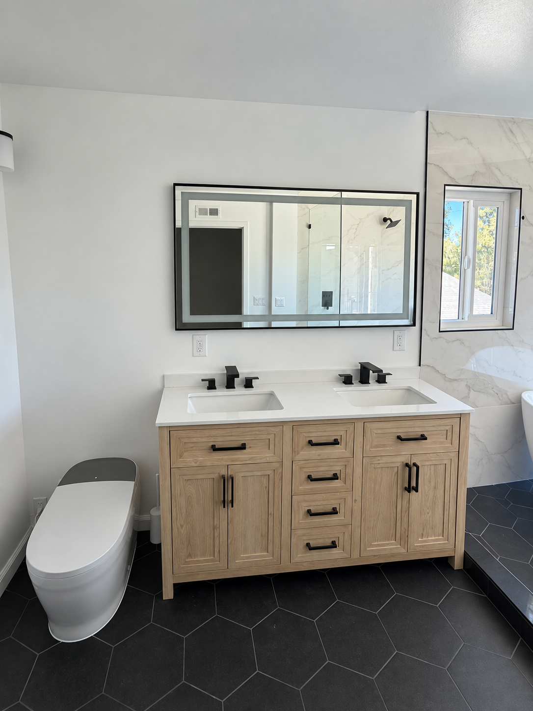 Double bathroom vanity and illuminated mirrors